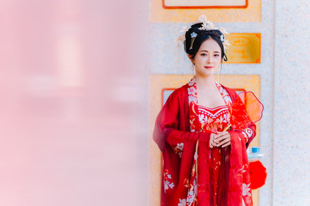 Woman dress China New year. portrait of a woman. person in traditional costume. woman in traditional costume. Beautiful young woman in a bright red dress and a crown of Chinese Queen posing.の写真素材