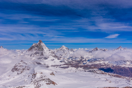 Matterhorn and other peaks with clouds around Zermatt, Switzerlandの写真素材