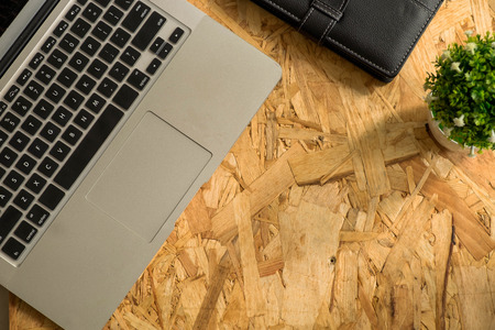 Flat lay of laptop on wood table. Backgroundの写真素材
