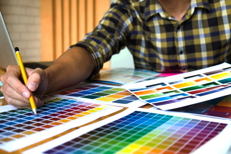 Graphic designers choose colors from the color bands samples for design .Designer graphic creativity work concept .の写真素材