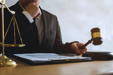 Lawyer working with contract papers on the table in office. consultant lawyer, attorney, court...