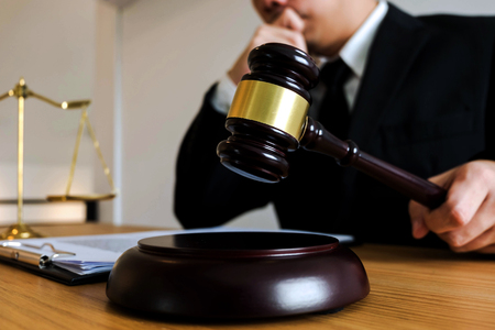 Judge with gavel on table. attorney, court judge,tribunal and justice concept.の写真素材