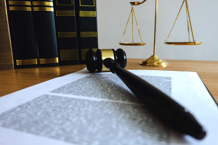 Close up object  law concept. Judge gavel with justice lawyers and documents working on table.