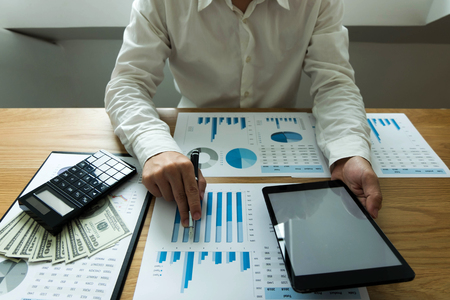 Businessman using tablet to the situation on the market value , Business concept.の写真素材
