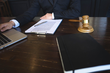 Lawyer working on the table in office. consultant lawyer, attorney, court judge, concept.の写真素材
