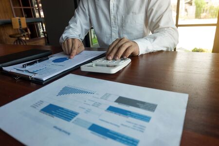 Businessmen calculate investment expansion business, saving money .finance concept .の写真素材