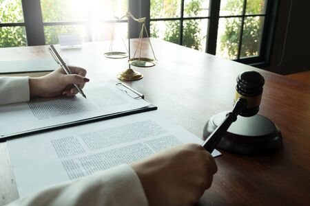 Lawyer working with contract papers on the table in office. consultant lawyer, attorney, court...