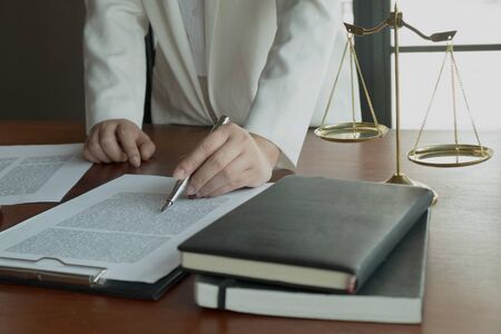 Lawyer working with contract papers on the table in office. consultant lawyer, attorney, court...
