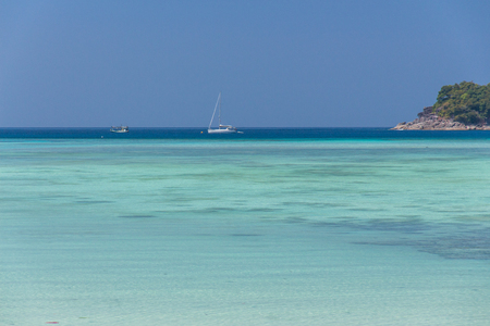 Clear blue sky with beautiful sea and boatの写真素材