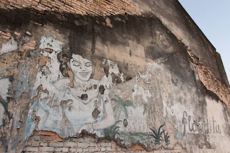 Woman Graffiti on the wall of old houseの写真素材