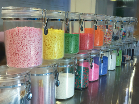 Colorful sweet in the glass bottleの写真素材