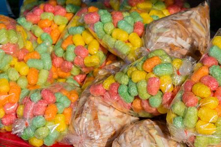 Colorful fish food in plastic bag