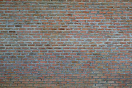 Brown orange of vintage bricks wall textured which can use for backgroundの写真素材