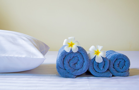 Well prepared in hotel bed with Frangipani flowers の写真素材