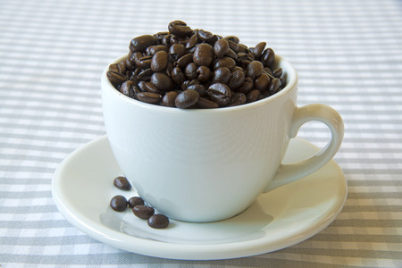 The coffee beans in a white cupの写真素材