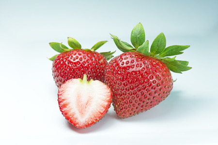 Strawberries on isolated white background in studio shot.の写真素材
