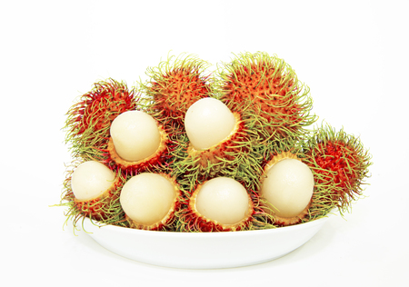 Group of rambutans arrangement on white plateの写真素材