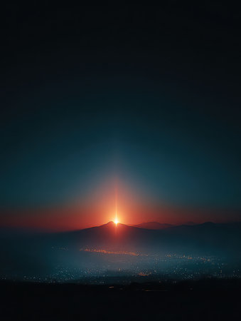 Breathtaking view of a sunrise illuminating mountain peaks with a vibrant glow. City lights twinkle below, creating a peaceful and serene atmosphere in nature.の素材