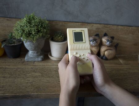woman hand and vintage toy game