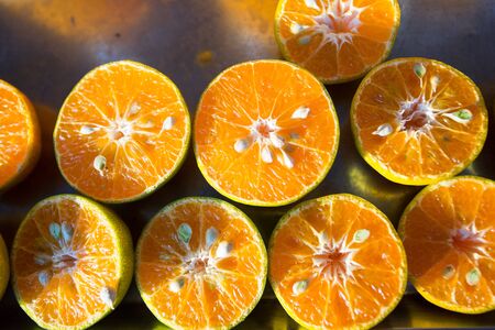 Sliced sweet and sour Mandarin Oranges in the market.の写真素材