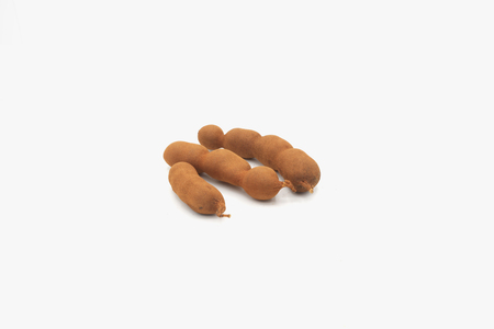 tamarind, sweet tamarind, brown tamarind isolated on white backgroundの写真素材