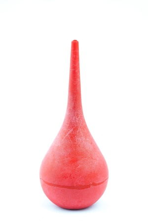 A red baby suction bulb shot againts whiteの写真素材