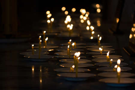 Closeup of burning candle in the templeの写真素材