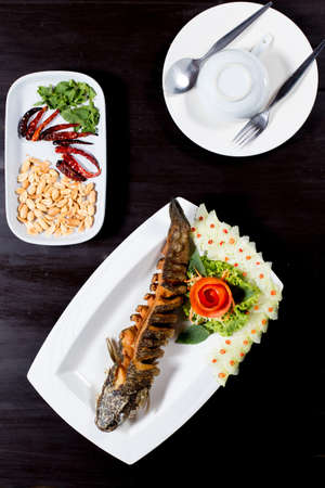 Spicy Fried fish with herbの写真素材