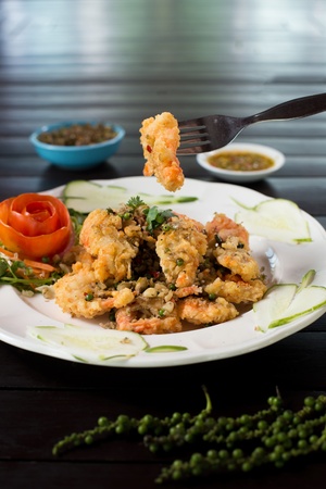 Spicy Fried shrimp with sauce and herbの写真素材