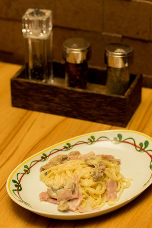 Spaghetti ham and mushroom with white sauceの写真素材