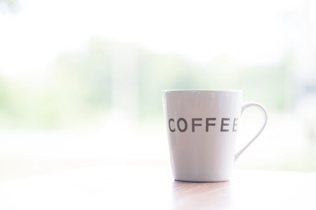 cup of coffee on wooden tableの写真素材