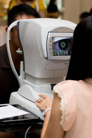 Male patient is having a medical attendance at the eye measuring