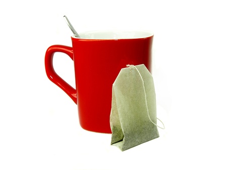 tea bag and red mugの写真素材