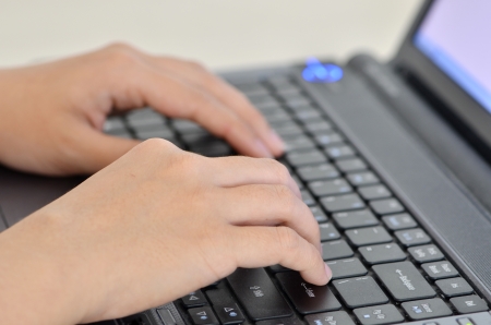 Hands typing on keyboardの写真素材
