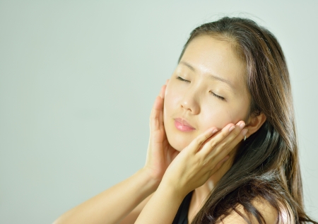 beautiful woman Face and hand touch face with smileの写真素材