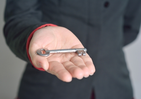 woman hand giving key