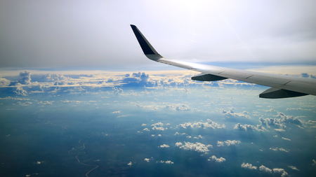 dramatic cloudy sky view from commercial airplane windowsの写真素材