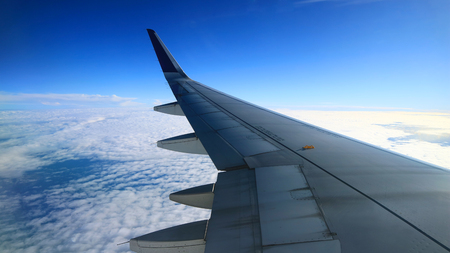 blue sky view from commercial airplane windowsの写真素材