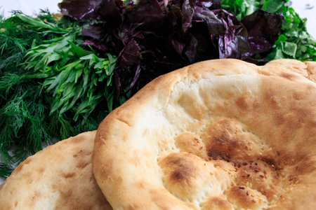 Pita bread with fresh dill, basil, coriander and tarragonの写真素材