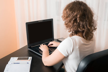 A women working on a laptop computerの写真素材
