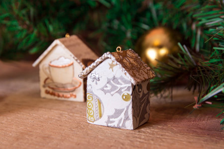 Fir tree decoration: handmade Christmas and New Year houses with ornamentsの写真素材