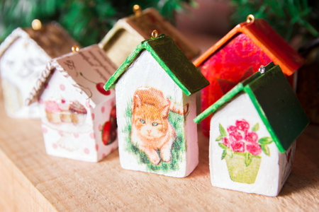 Fir tree decoration: handmade Christmas and New Year houses with ornamentsの写真素材