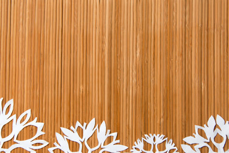 Christmas and New Year background with snowflakes and mat with space for your textの写真素材