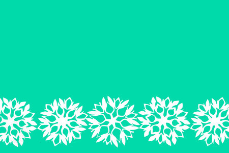 Green New Year and Christmas background with white snowflakes for your textの写真素材