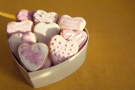 White and pink cookies with frosting in the shape of a heart in a box. Valentine's Dayの写真素材