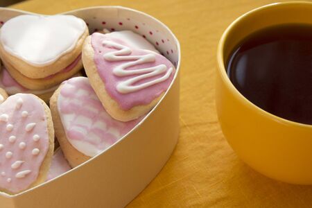Cup of tea and cookies with frosting in the shape of a heart. Valentine's Dayの写真素材