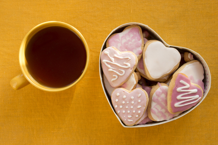 Cup of tea and cookies with frosting in the shape of a heart. Valentine's Dayの写真素材