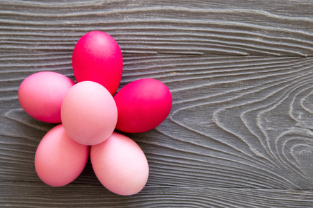 Colored painted eggs on a gray background. Easter celebrating の写真素材