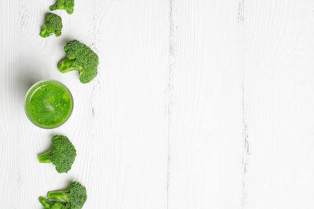 Green Smoothie of broccoli on a white background with space for textの写真素材