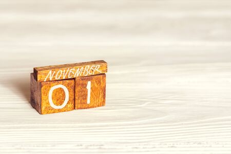 November 1st. Vegan day. Wooden calendar on white backgorund with copyspaceの写真素材